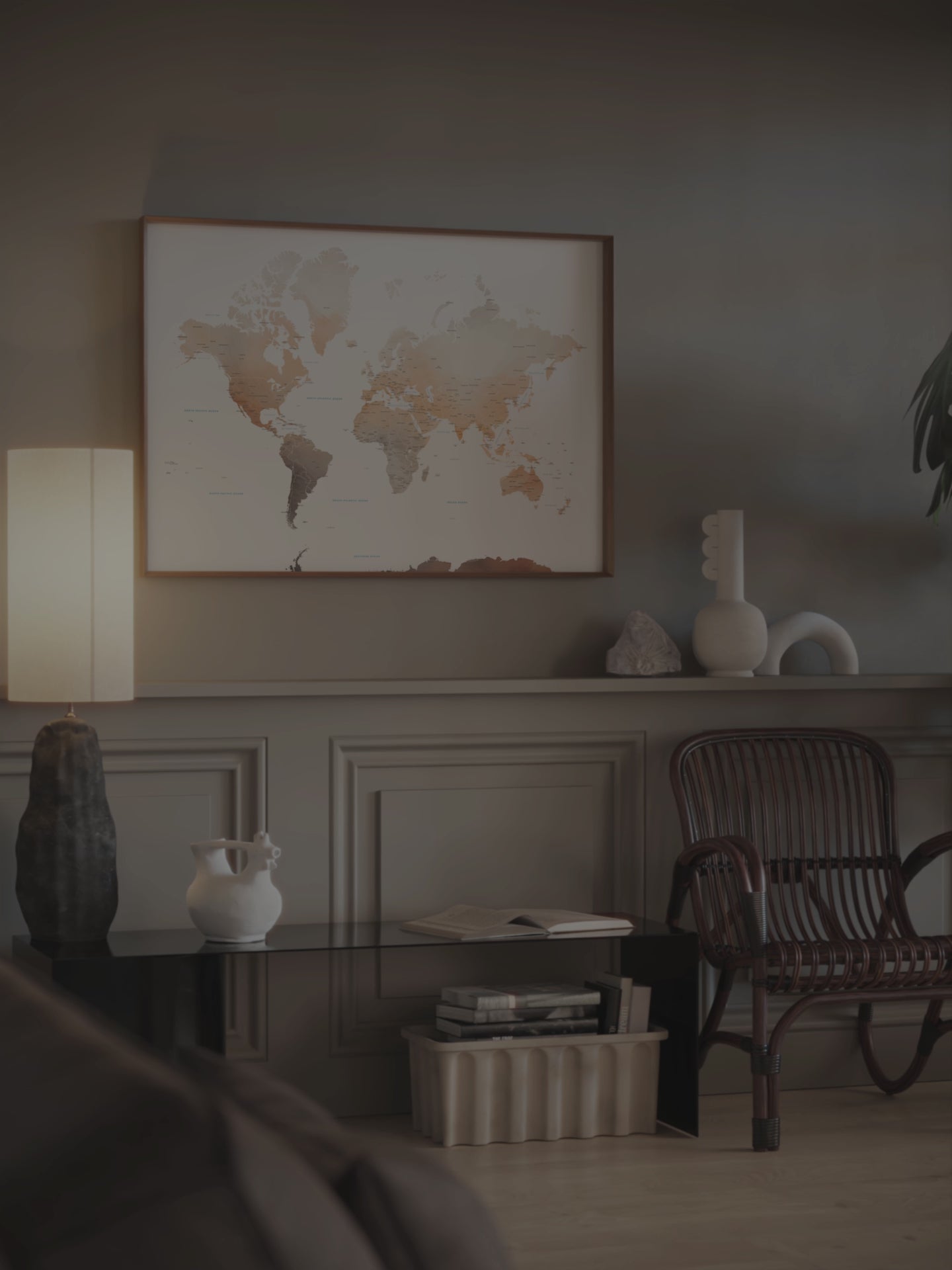 Watercolor World Map wall art in a dark wood frame.