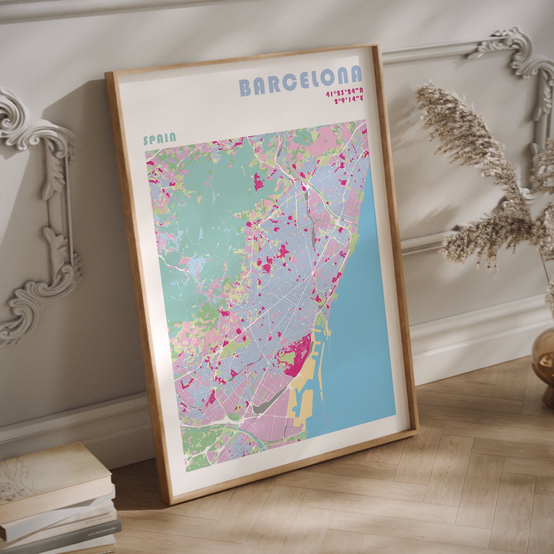 Barcelona city map print in a natural wood frame.