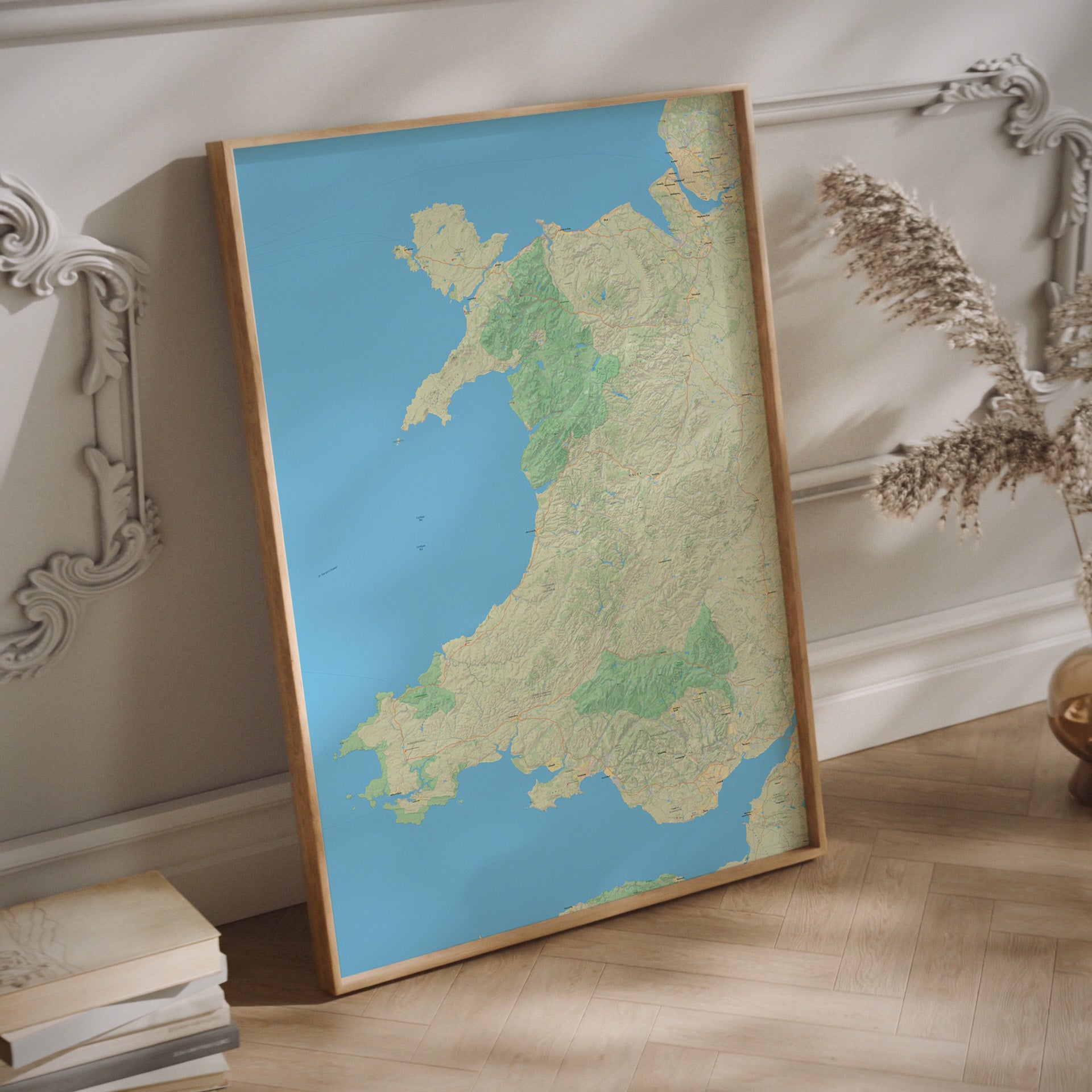 Relief map of Wales in a wood frame.