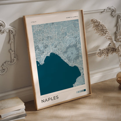 A Naples city map print in blue tones in a wood frame