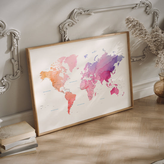 Colorful watercolor world map print in a wood frame.