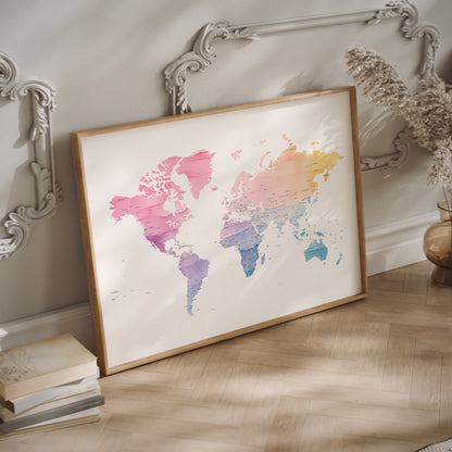 A watercolor world map in a wood frame.