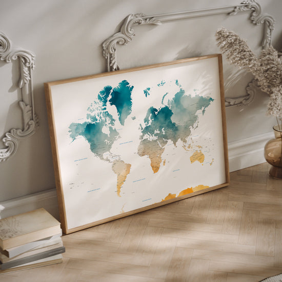 Green and yellow watercolour world map in a wood frame