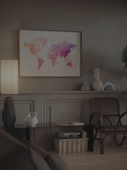 Watercolor world map art print in a wood frame.