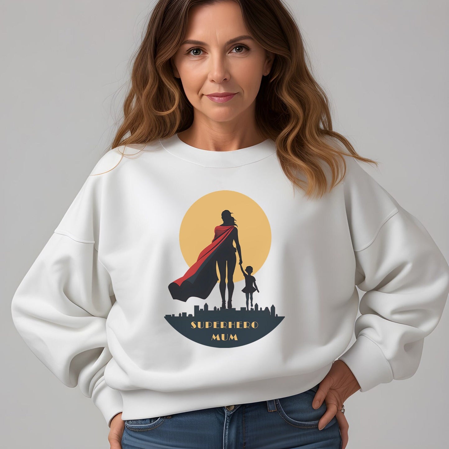 Woman wearing a superhero mum crewneck sweater in white color.